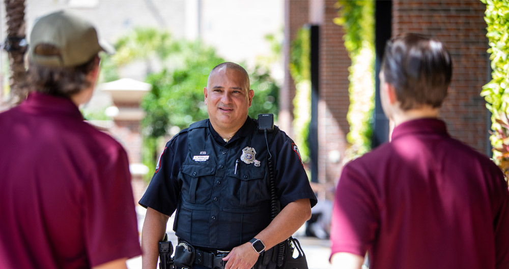 Campus safety officer with two students 