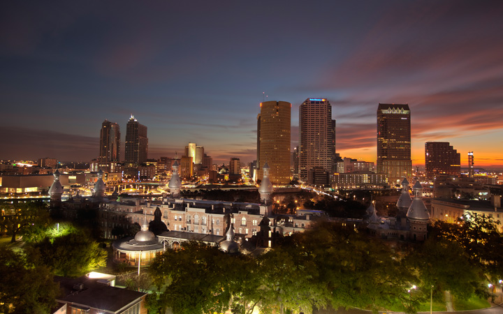 The University of Tampa with the downtown skyline in the background at dusk