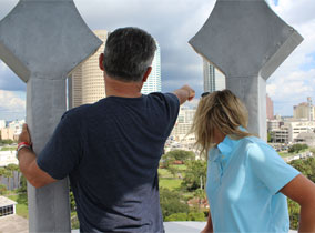 Two people looking through a minaret at downtown Tampa 