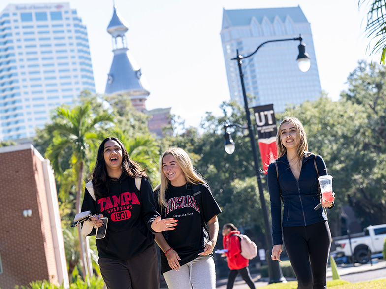 Student walking across campus