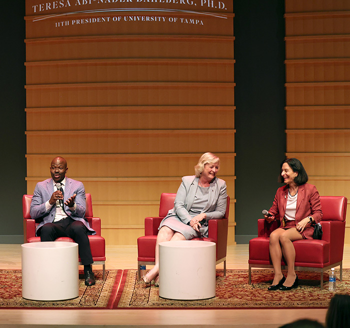 President Dahlberg and two college presidents at the inauguration week symposium.