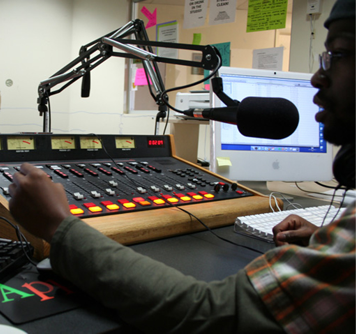 Student working at WUTT radio station radio