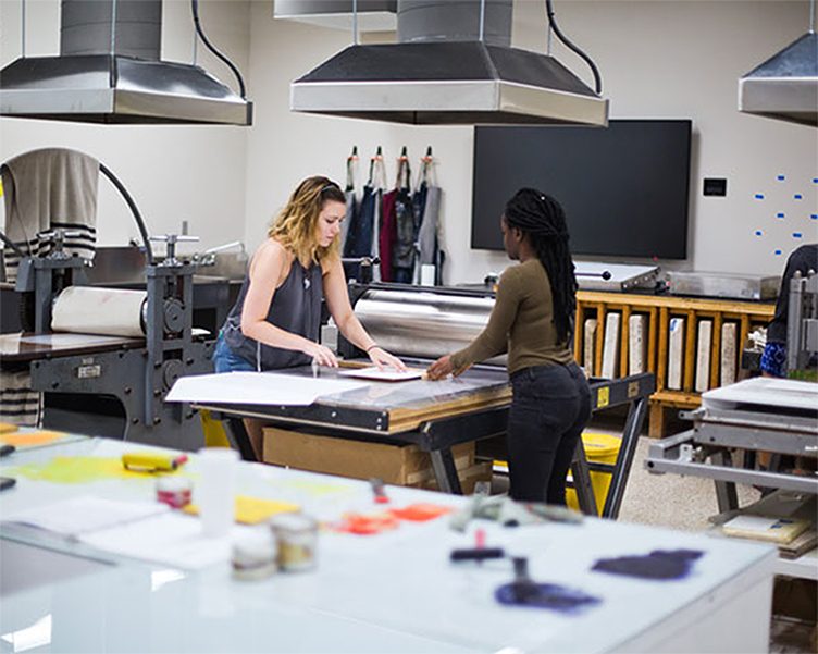 Students working in the printmaking studio