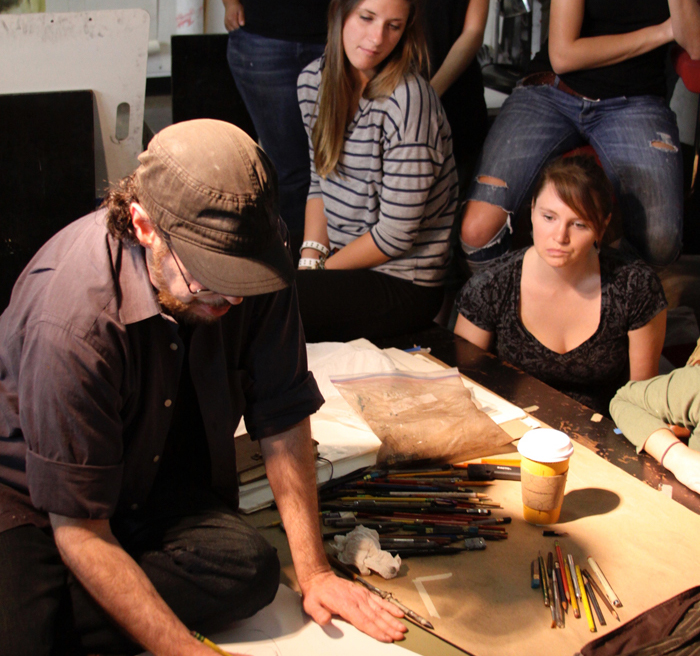 students watching artist students watching artist