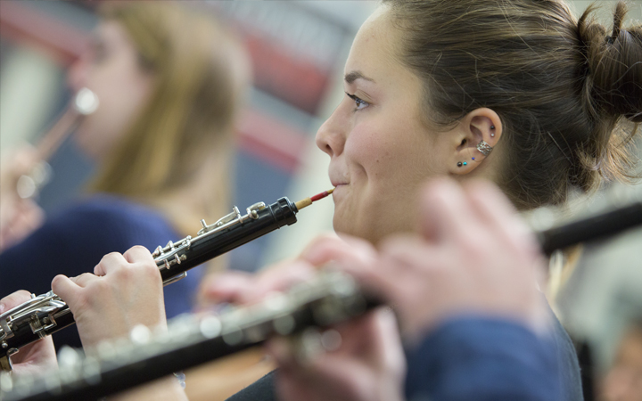 Student playing the oboe Student playing the oboe