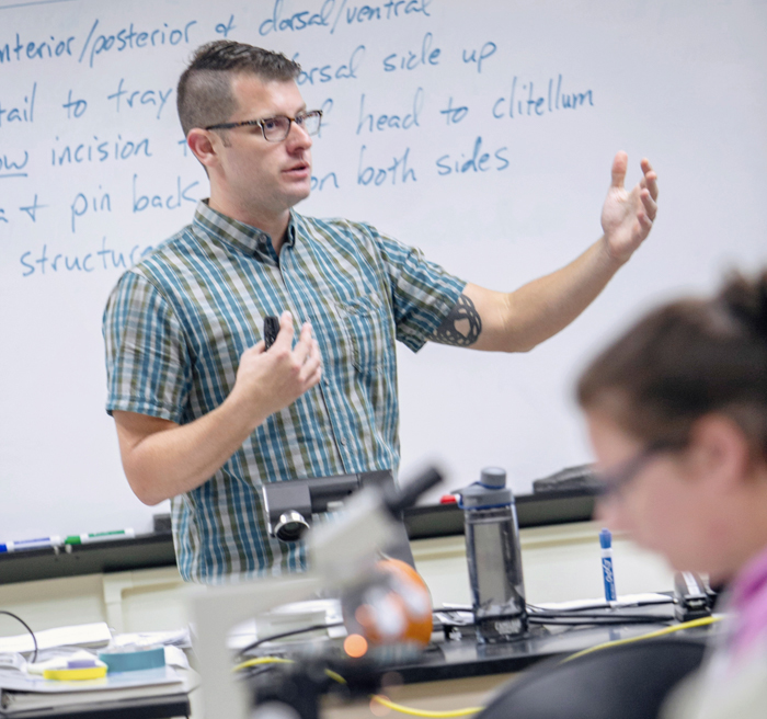 Professor Dan Huber giving a biology lecture. Professor Dan Huber giving a biology lecture.