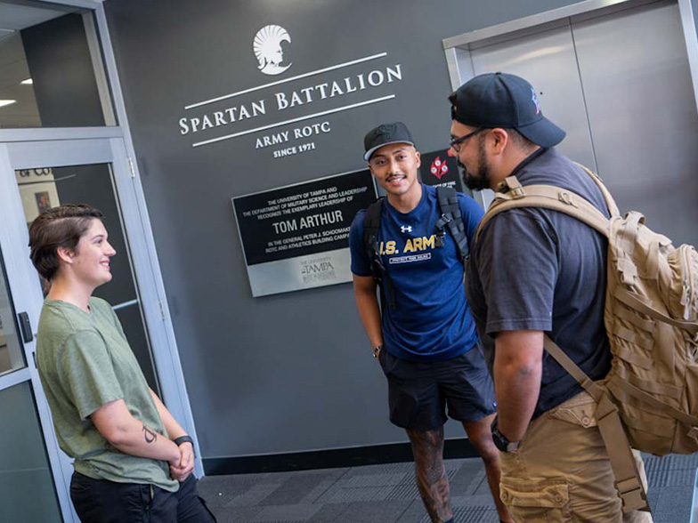 Veteran students talking with an advisor.