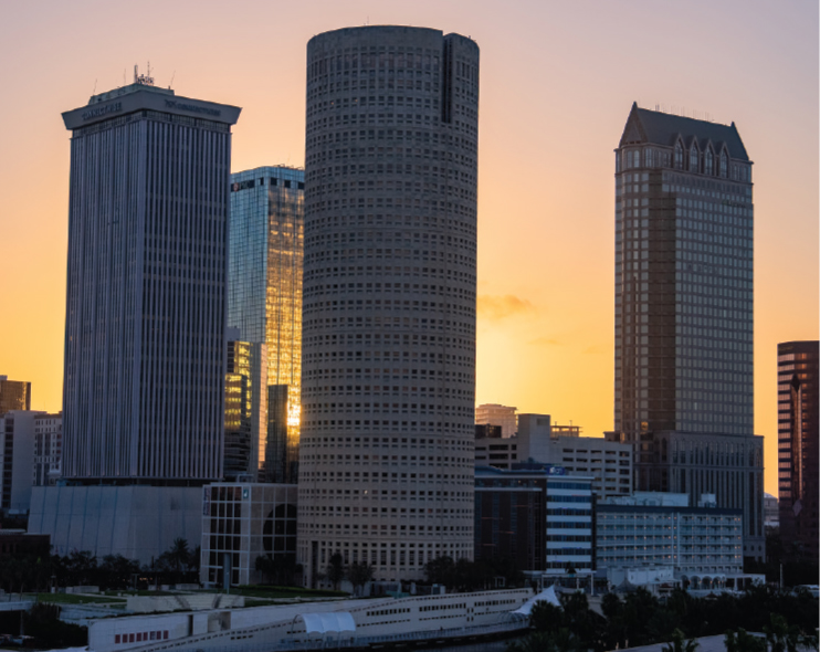 A CITY SKYLINE AT SUNRISE