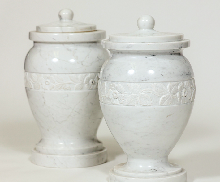 Two white marble urns