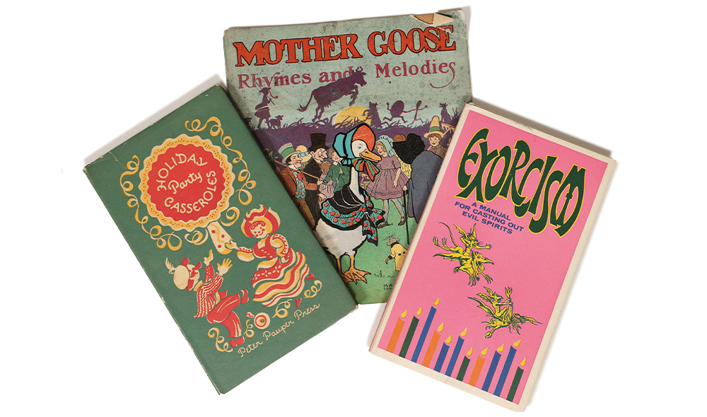 Three books arranged like a fan