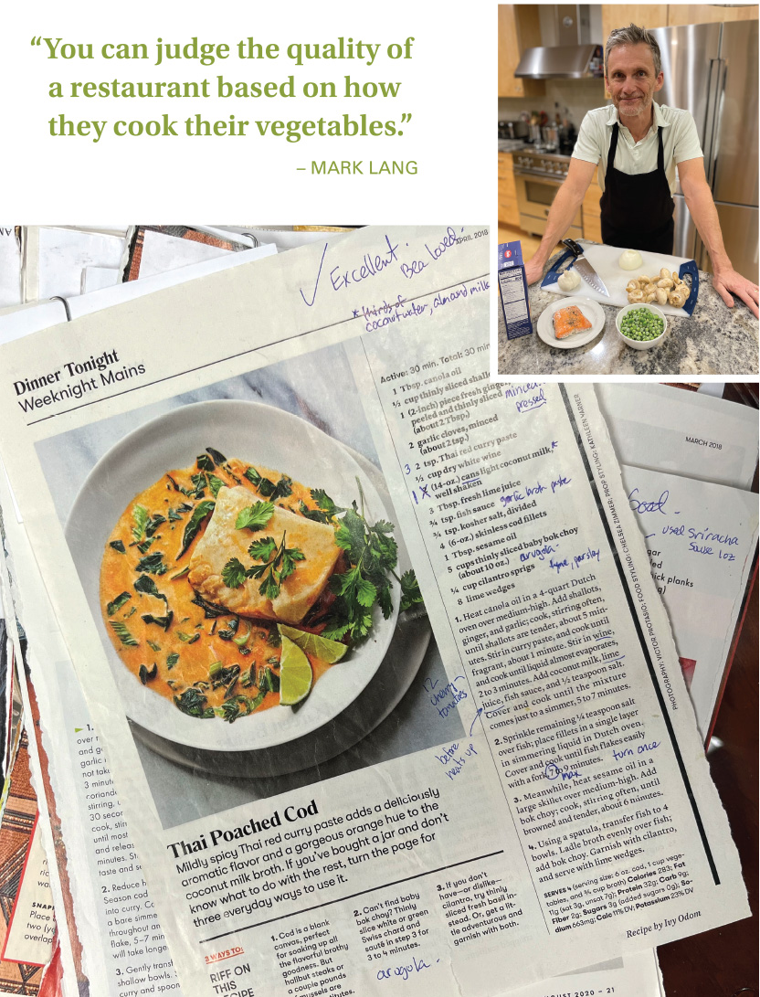 MARK LANG IS SHOWN IN HIS HOME KITCHEN WEARING AN APRON