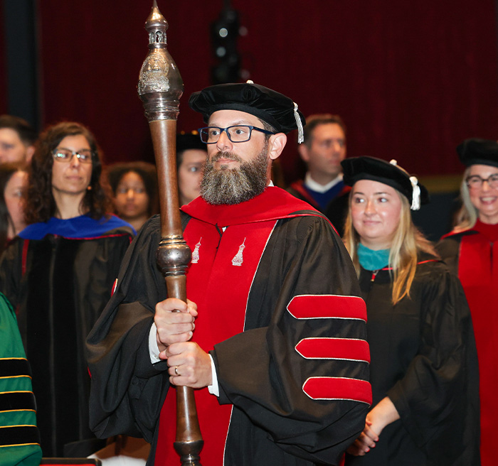 Professor Dan Huber leading faculty into the inauguration ceremony.