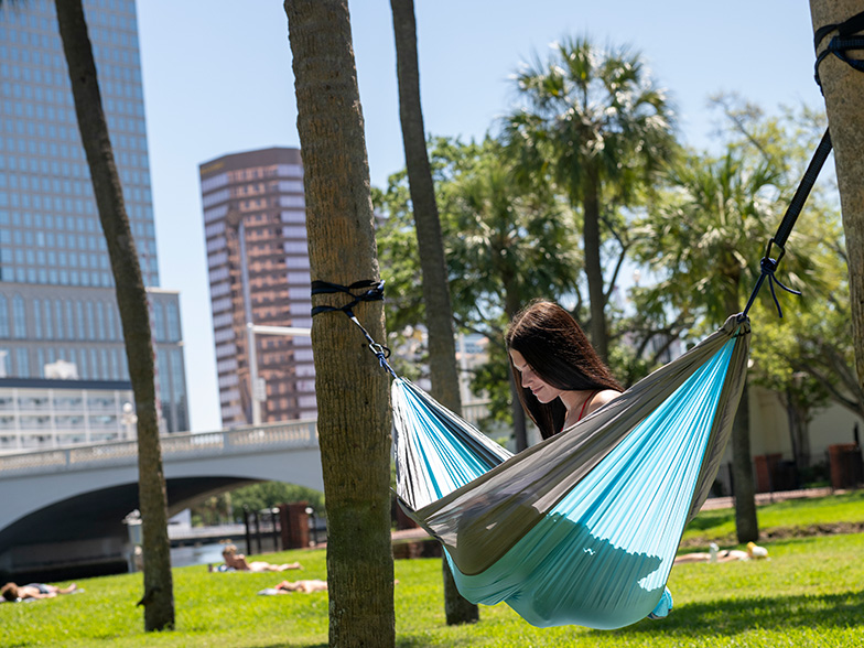 Student in hammock in Plant Park