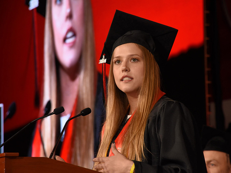 A graduate speaking at commencement.
