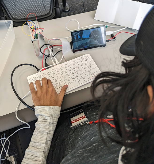 CyberSpartan working on programming