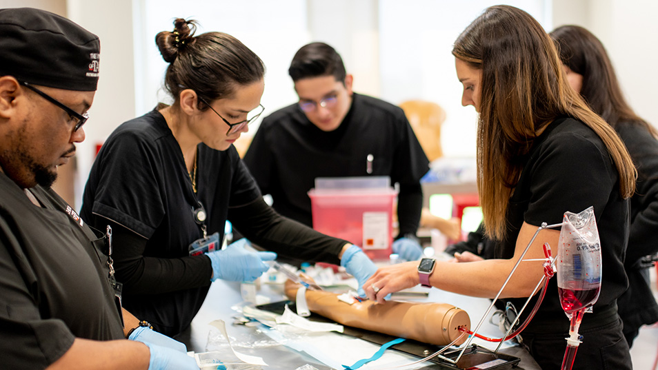PA student practicing treatment in a lab.