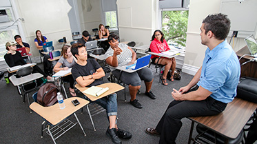 Students talking with a criminology professor.