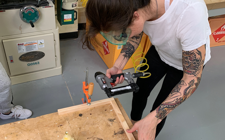 Person using nail gun
