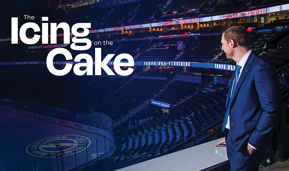 Image of a man overlooking the ice in a hockey arena