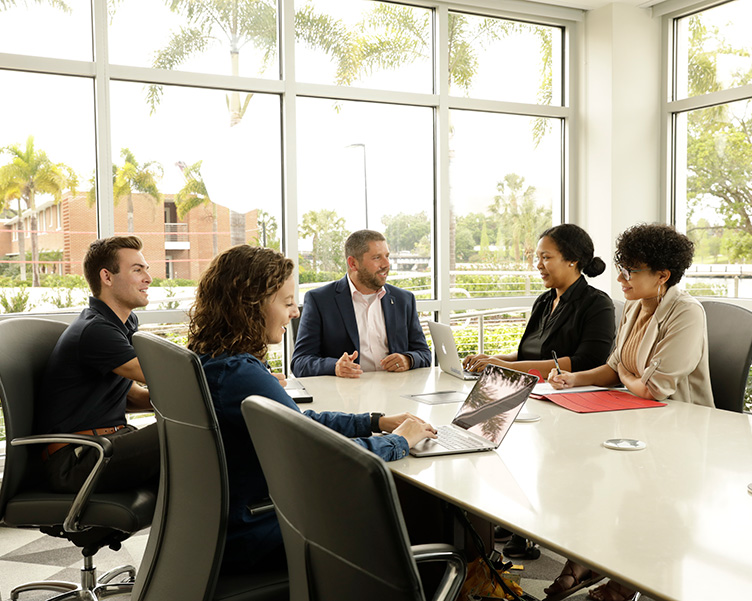students in a board room receiving job search counseling