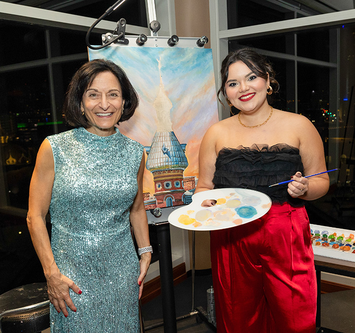 President Dahlberg and a student painting