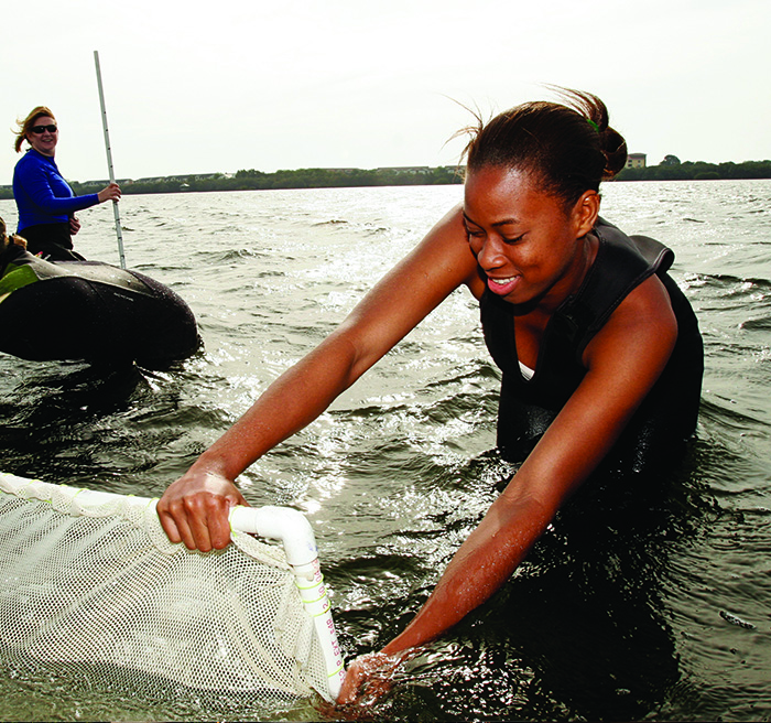 Student skimming water