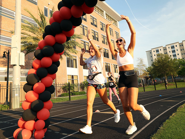 Give Day 5k participants cross the finish line