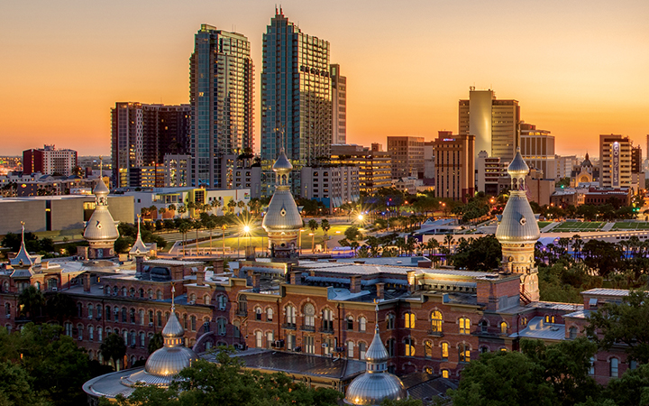 Sunset view of Plant Hall with downtown Tampa in the background
