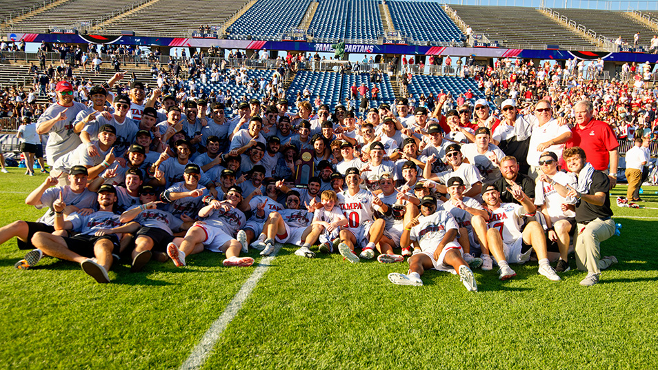 A crowd at a men's Lacrosse game
