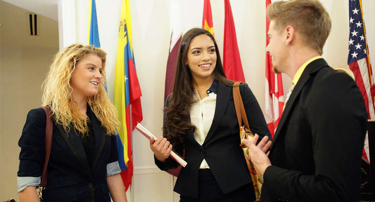 Students in the Sykes College of Business talking.