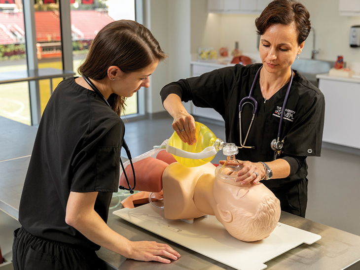Students performing CPR on a mannequin