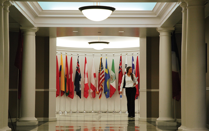 Person walking inside Sykes College of Business