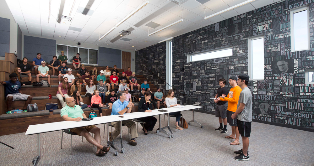 two students pitching a business idea