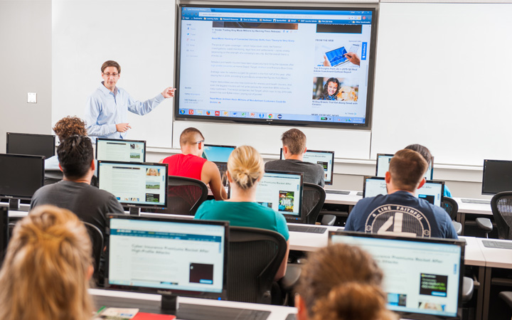 Professor teaching a cybersecurity class