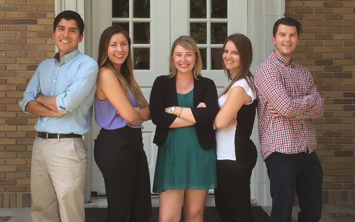 5 students in business casual attire