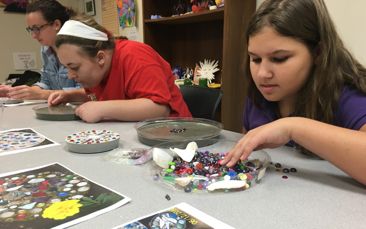 People working on an art project