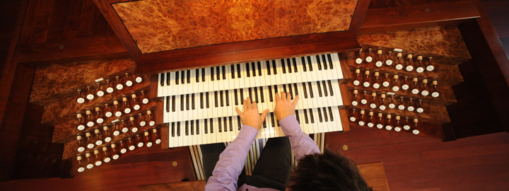Student playing organ