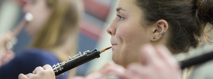 Student playing an oboe
