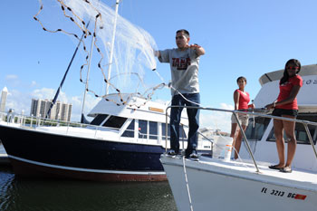 Person casting net from a boat