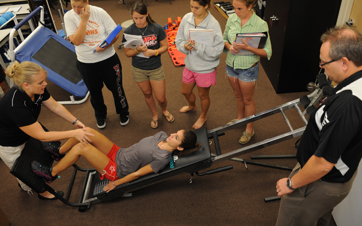 Students watching someone exercise