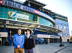 Students standing in front of Amalie Arena