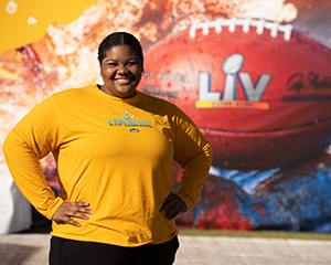 Student volunteering at the Super Bowl Experience