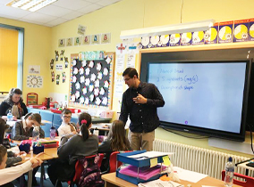 teacher teaching secondary students