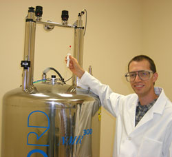 Eric Ballard using a nuclear magnetic resonance (NMR) spectrometer