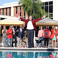 Keith Todd standing by pool