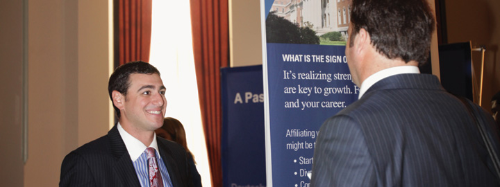 2 people talking at a job fair