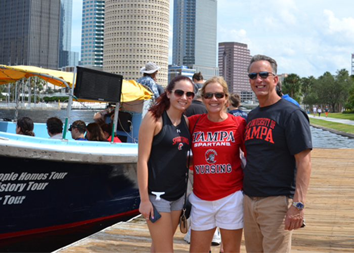 student and family by river 