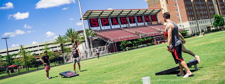 Students playing cornhole