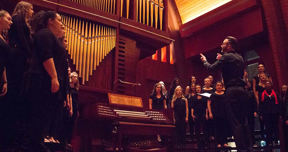 Music students singing in the chapel