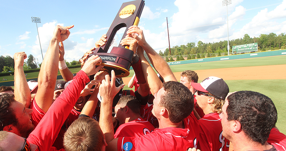 Baseball team holding NCAA trophy